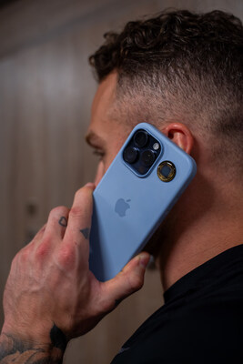 Max Domi using his smartphone with Aires Tech's Lifetune One. Lifetune One offers immediate protection against electromagnetic radiation within close proximity to your body, covering up to 19 feet in diameter.