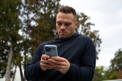 Max Domi using his smartphone with Aires Tech's Lifetune One. Lifetune One offers immediate protection against electromagnetic radiation within close proximity to your body, covering up to 19 feet in diameter.