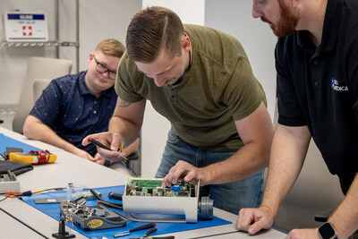 Students participating in a hands-on Infusion Pump training course during the first CBET class in the new Customer Experience Center.