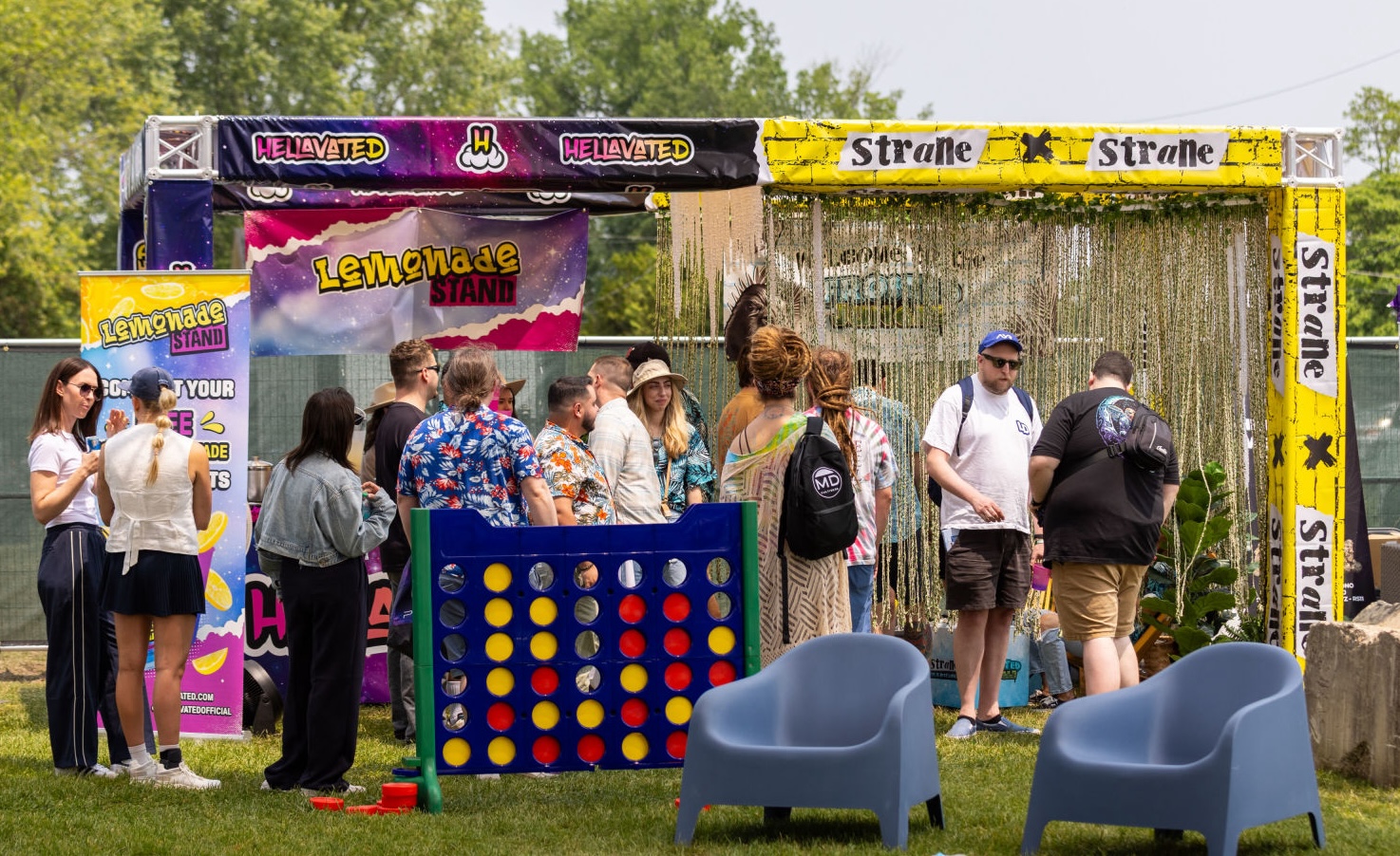 Attendees engage in networking and enjoy interactive experiences at a Flower Expo event.