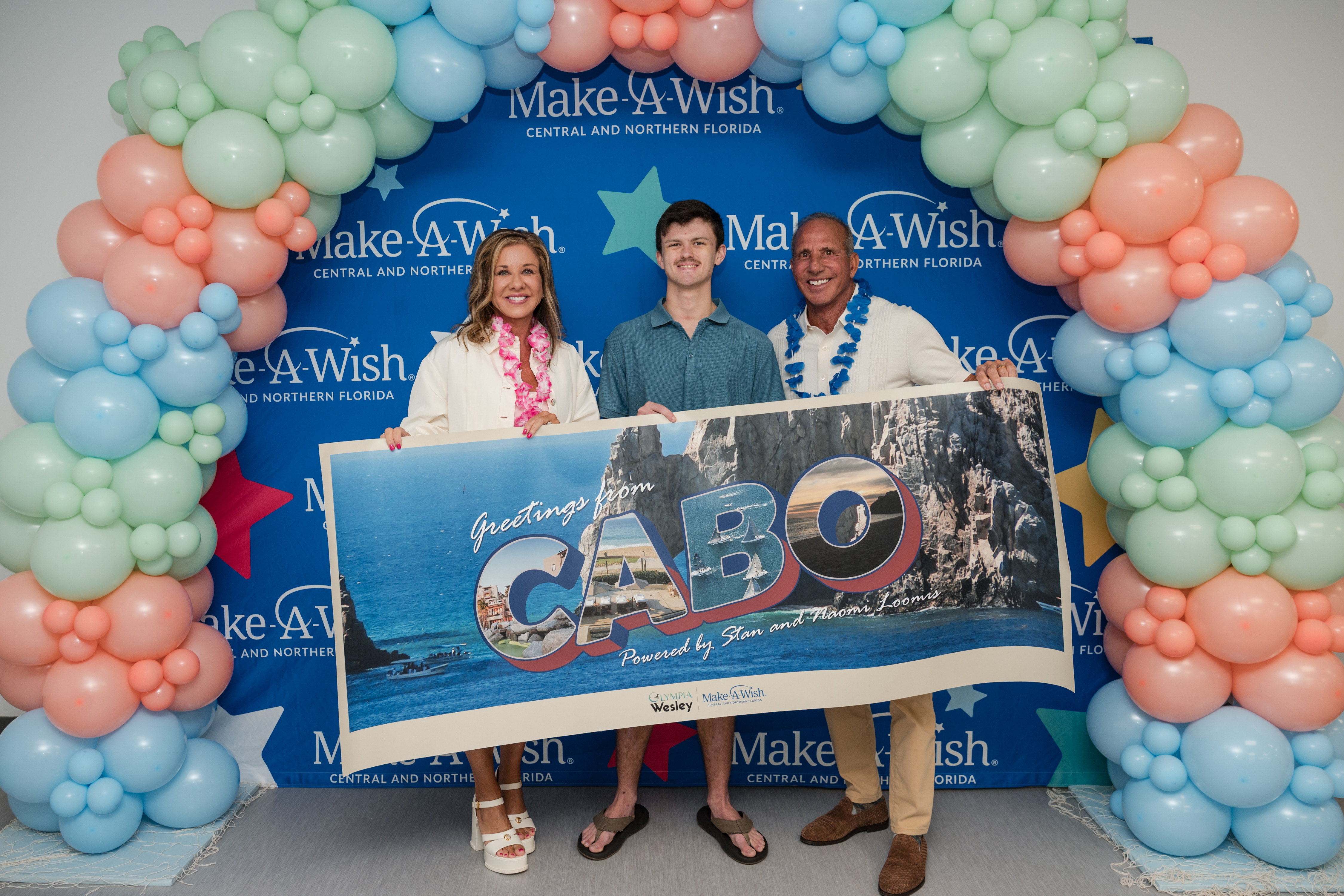 Stan and Naomi Loomis smile with Jeremy.