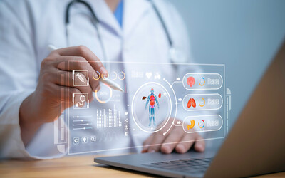 Physician reviewing digital medical data on a transparent virtual screen, including body scans and organ health indicators