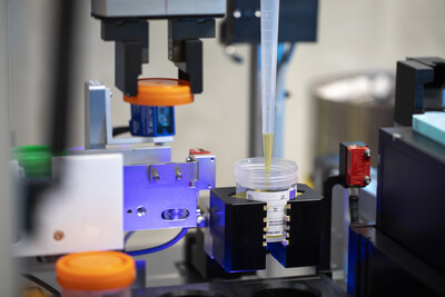 Vision-guided system identifies containers and performs decapping without manual sorting.