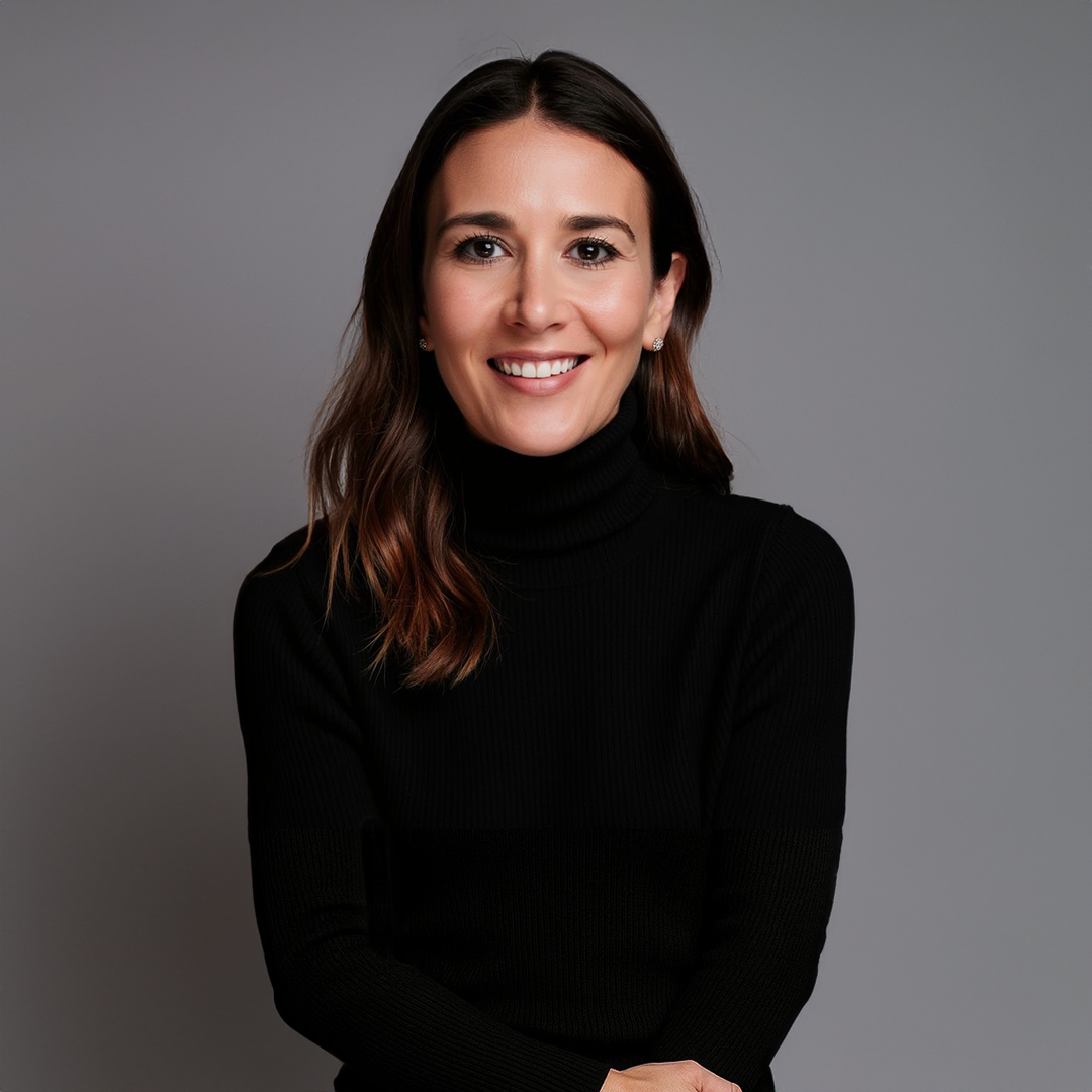 Professional headshot of Georgia Kastaris, Founder and CEO of Expecting Together, smiling in a black sweater.