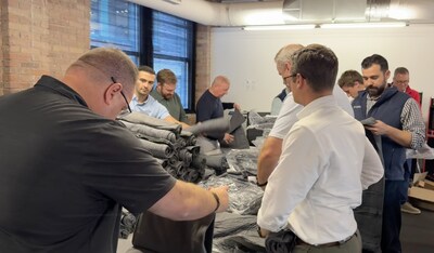 Liberty Advisor Group employees pack 300 care packages for patients. Liberty Advisor Group employees pack 300 care packages for patients.